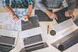 © Ngampol - Professional Developer programmer cooperation meeting and brainstorming and programming in website working a software outsourcing and coding technology, writing codes and database
