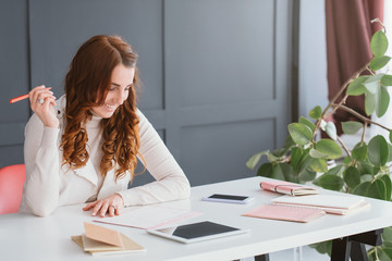 Scheduling agenda. Ambitious marketing plans. Content smm woman at workplace. Timetable, tablet and smartphone.