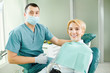 © Studio Romantic - Dentist and patient are smiling
