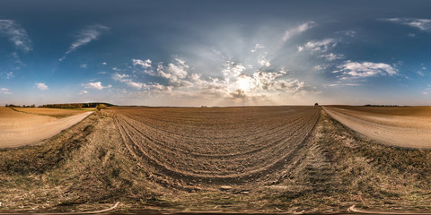 Wall Mural - full seamless spherical panorama 360 degrees angle view near gravel road among meadow fields in spring evening sunset with awesome clouds in equirectangular projection, VR AR virtual reality content