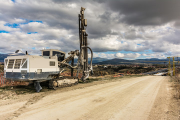 Wall Mural - Drilling machine in a construction site