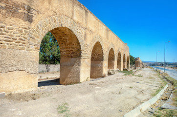 Ancient ruins of aqueduct near roman town Uthina (Oudhna). Tunisia, North Africa