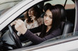 © F8  \ Suport Ukraine - Young woman shaking hers fist sitting in vehicle drive her car