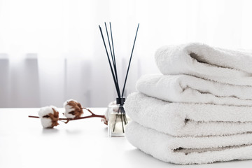 Stack of white cotton clean towels close-up