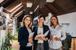 © bnenin - Group portrait of confident female business team.