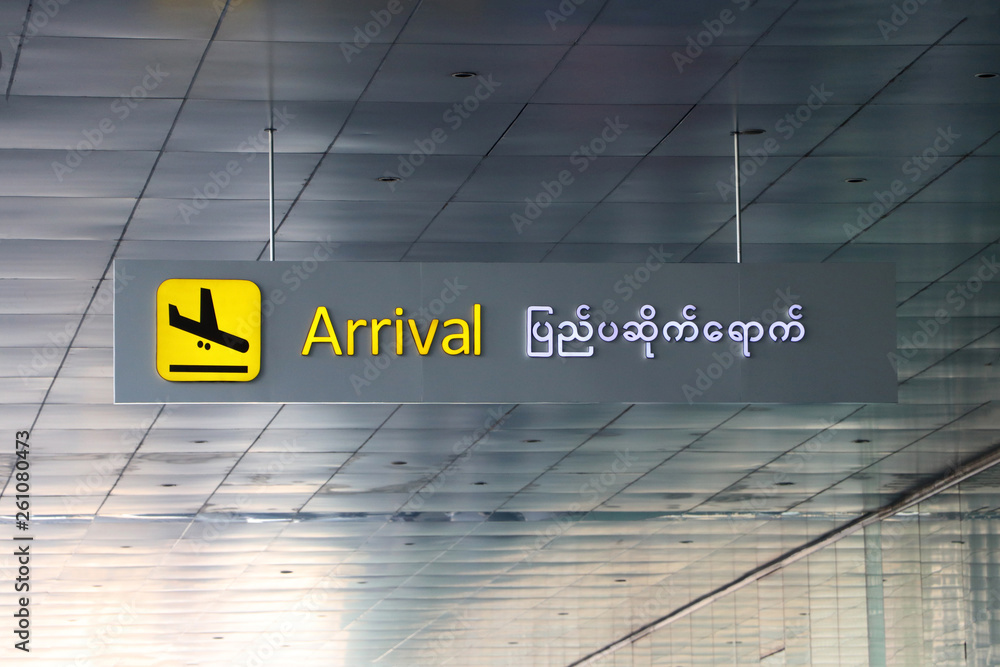 Arrival sign in english and Myanmar language with symbol of the plane ...