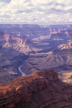 Afternoon Light Paints The West Rim Of The Grand Canyon.  Photographed From Hopi Point, Grand Canyon National Park, Arizona.  Image Captured On Fuji Velvia Film With Nikon F4 Camera.