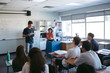 © Rob and Julia Campbell/Stocksy - Highschool student giving presentation during class