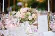 © Seth Mourra/Stocksy - Elegant Outdoor wedding tabletop with florals
