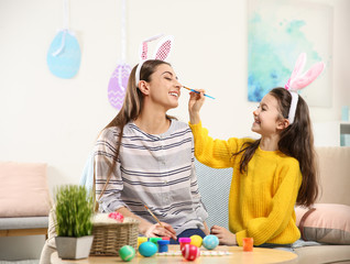 Sticker - Mother and daughter with bunny ears headbands having fun at home. Easter holiday