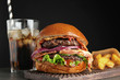 © New Africa - Tasty burger with bacon and fried potatoes served on table