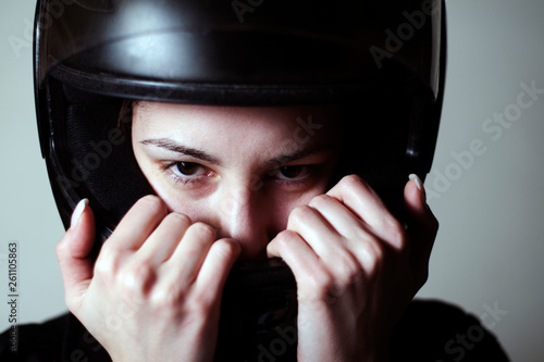Female biker with helmet, dangerous sport Slika na platnu