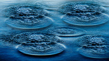Ripples On Sea Abstract Texture Pattern Background. Splashes, Ripples, Circles Made By Stones Thrown Into Sea. Round Droplets Of Water Over Circles On Ocean. Fresh Bright Water Drop, Whirl, Splash. 