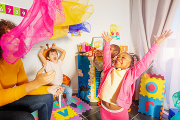 Wall Mural - Group of happy laughing kids throw handkerchief