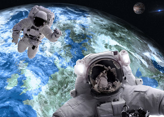 Wall Mural - asrtonauts in outer space near earth and mars planets of solar system. science fiction wallpaper. el