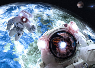 Wall Mural - asrtonauts in outer space near earth and mars planets of solar system. science fiction wallpaper. el