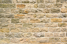 Background From A Beige Natural Stone Wall