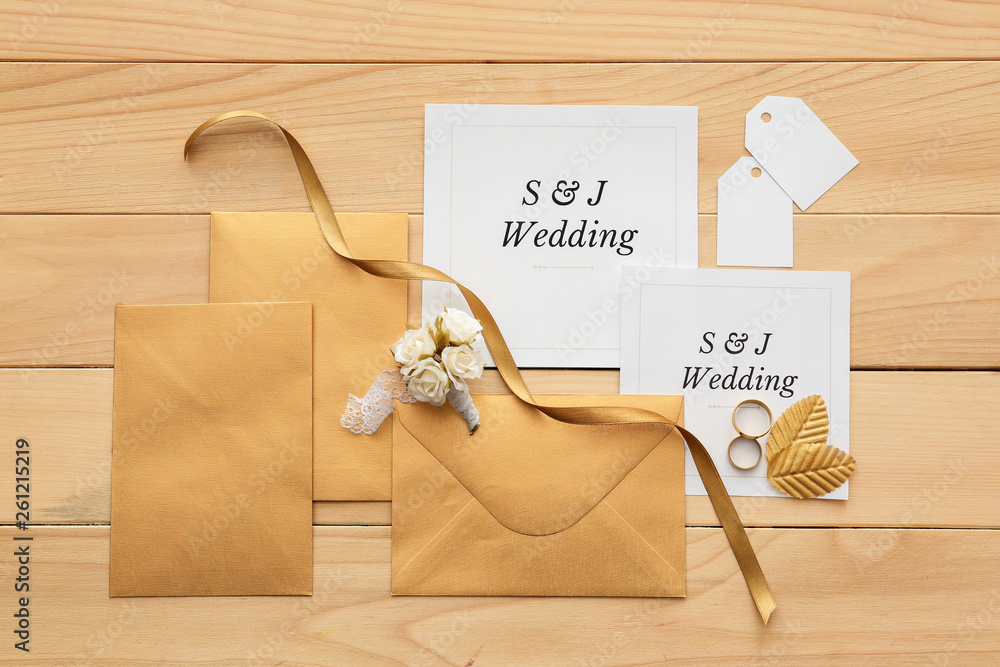 Wedding invitations on wooden background