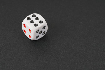 a dice over black surface