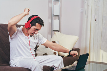 Wall Mural - young boy enjoys listening to music