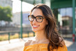 © Rido - Smiling woman wearing eyeglasses outdoor