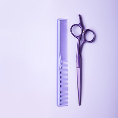 Stylish professional barber scissors and comb, hairdresser salon concept, hairdressing tool set. Haircut accessories