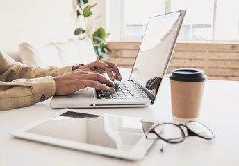 Businessman using laptop at home. Men student working on computer. Internet marketing, freelance work, online education concept