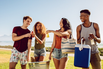 Group of people going on beach party