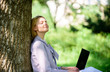 © be free - Natural environment office. Work outdoors benefits. Woman with laptop work outdoors lean tree. Minute for relax. Education technology and internet concept. Girl work with laptop in park sit on grass