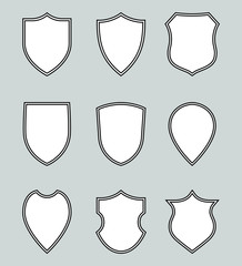 Wall Mural -  Nine icons heraldic shields. Protection symbols. Isolated signs shields on grey background. Vector illustration