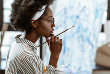 African-American Artist Feeling Thoughtful Working On New Picture