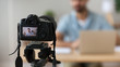 © fizkes - Close up successful man recording video, using digital camera