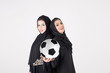 © Mahmoud Rahall - Two females holding and playing with soccer ball