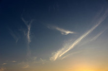 Cloudscape Background Of Fine Wispy Lines Of Clouds In A Blue Sunset Sky