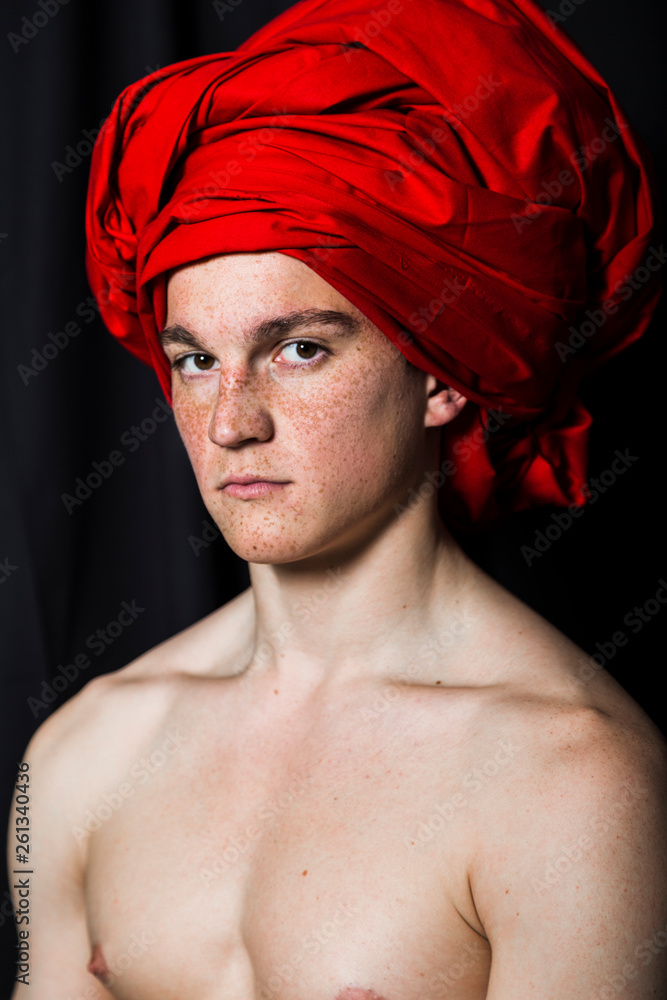 Man with naked torso in red turban in studio - obrazy, fototapety, plakaty 