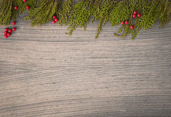 top view on nice christmas gift wrapped in white gift paper, tree decorations on white wooden white 