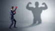 © ra2 studio - Businessman fighting with his bossy yelling shadow