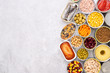 Canned food on stone background, top view with copy space
