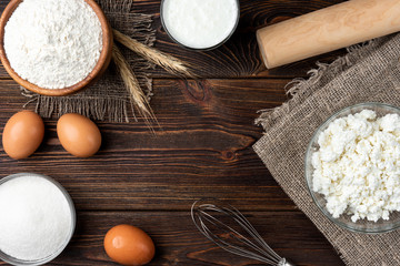 Wall Mural - Ingredients for preparation cottage cheese pancakes. Cottage cheese, eggs, milk, sugar and flour. 