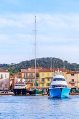 Wall Mural - Boats and luxury yachts in por of Saint Tropez, France