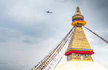 NEPAL, BOUDHANATH STUPA - AUGUST 19, 2014: Top Of Boudhanath Stupa Temple With Color Flags Decorating