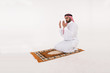 © Mahmoud Rahall - Muslim man praying on white Background