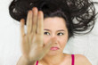 © Nutt - Closeup portrait of moody asian women  lying on ground with black long hair. acting upset , unhappy,