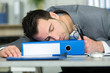 man napping on his desk