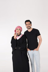 Arab couple standing and posing on white background