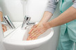 © auremar - selective focus washing hands in toilet