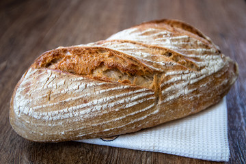 Homemade healthy freshly baked organic whole grain unleavened bread on wooden table