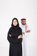 © Mahmoud Rahall - arab couple smiling and standing on white background