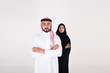 © Mahmoud Rahall - arab couple smiling and standing on white background