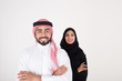 © Mahmoud Rahall - arab couple smiling and standing on white background